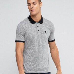 A man wearing a Logo In Grey polo shirt and jeans.