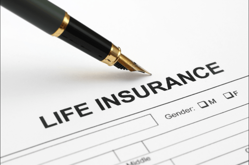A pen is sitting on top of a life insurance form.